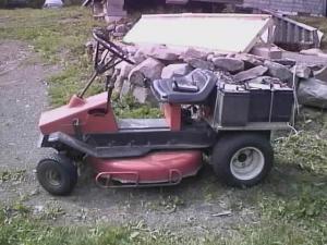 Riding mower being charged